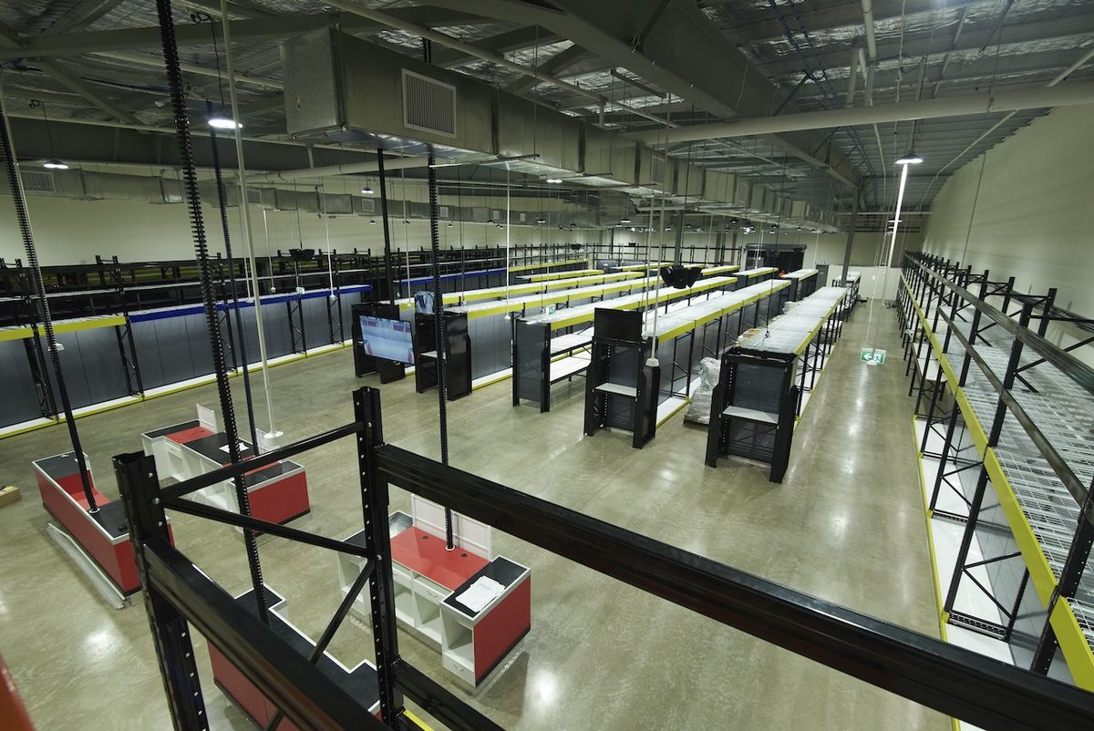 Commercial retail fitout showing installed racking and fixtures ahead of store opening
