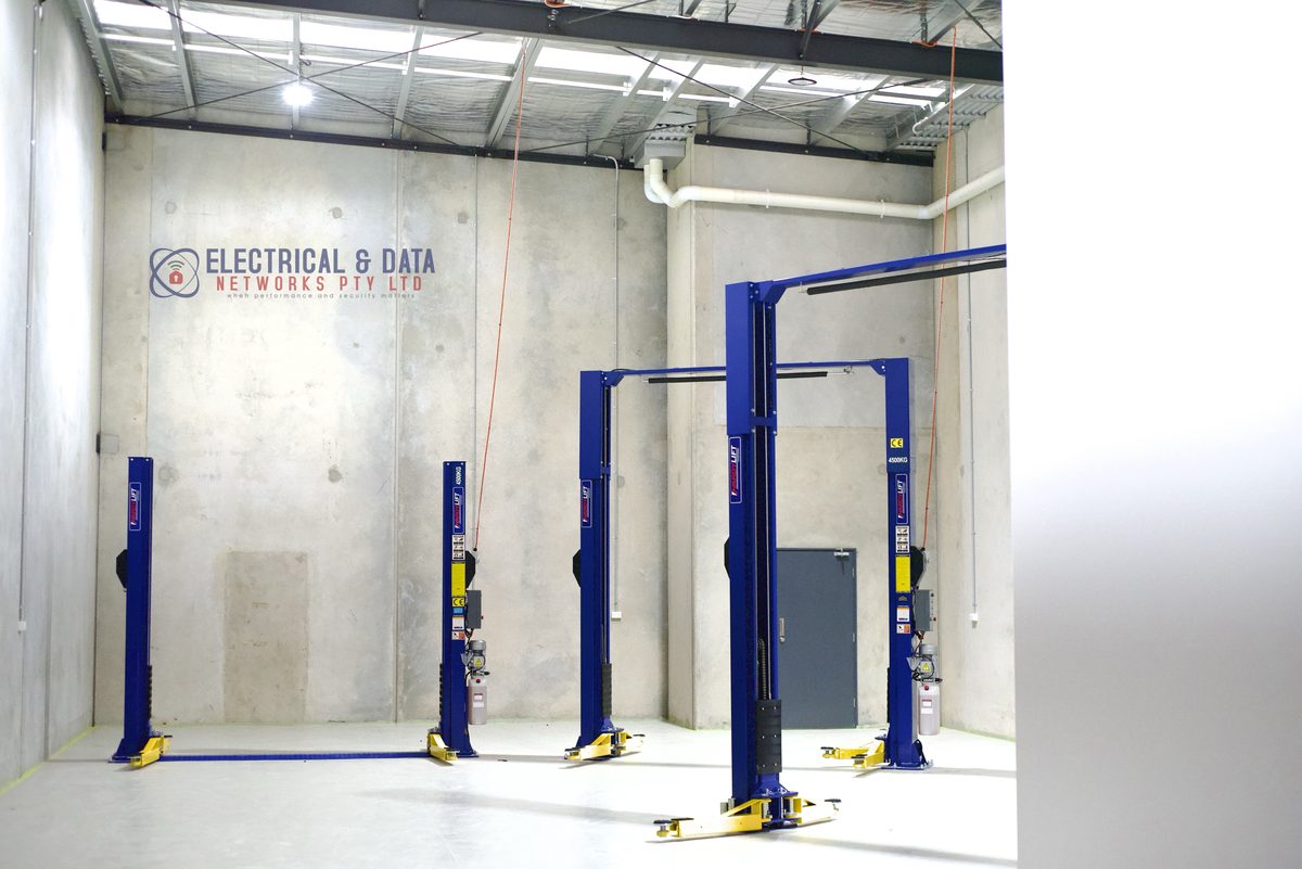Two-post vehicle hoists and workshop power installed by EDN for a commercial automotive workshop