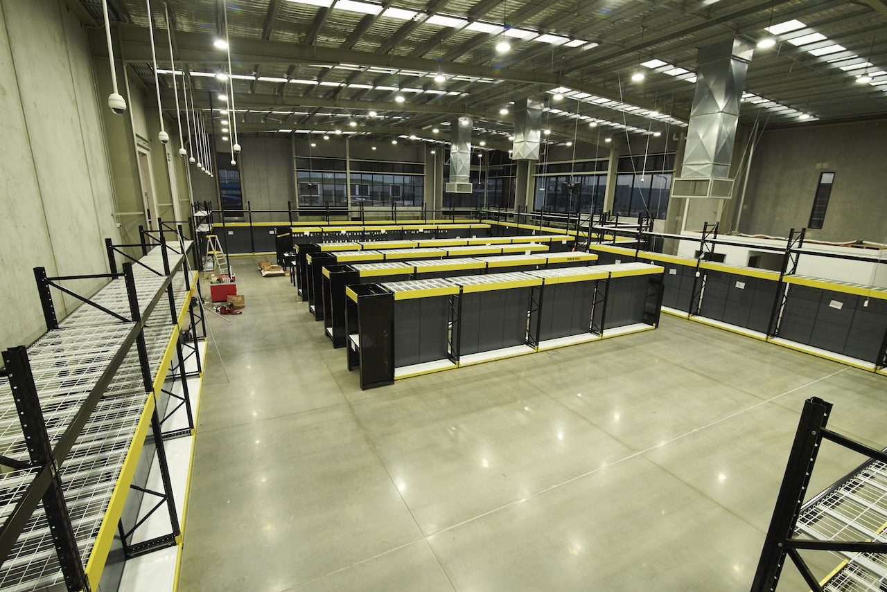 EDN service vehicles on site at a Total Tools store during a commercial electrical and data installation